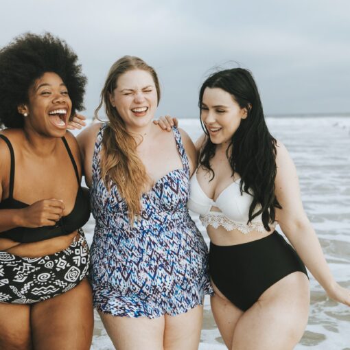 Cheerful Plus Size Women Enjoying The Beach